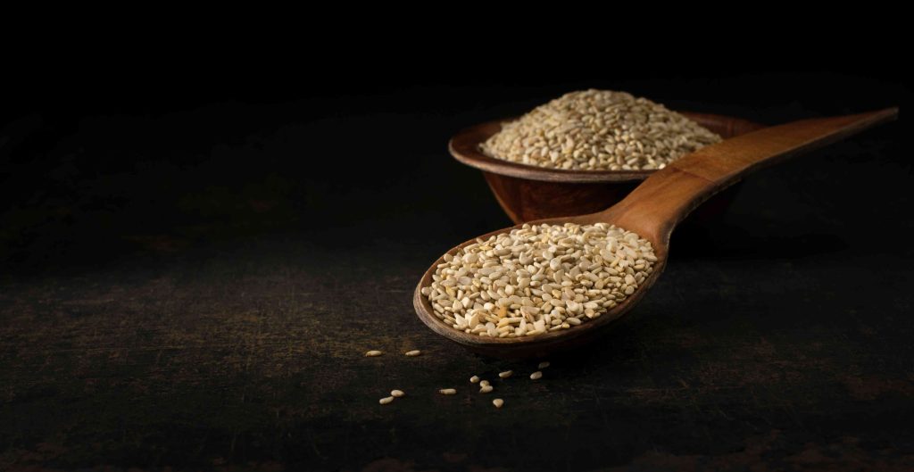 a-wooden-spoon-and-bowl-of-sesame-seeds-2026-03-17-04-21-34-utc